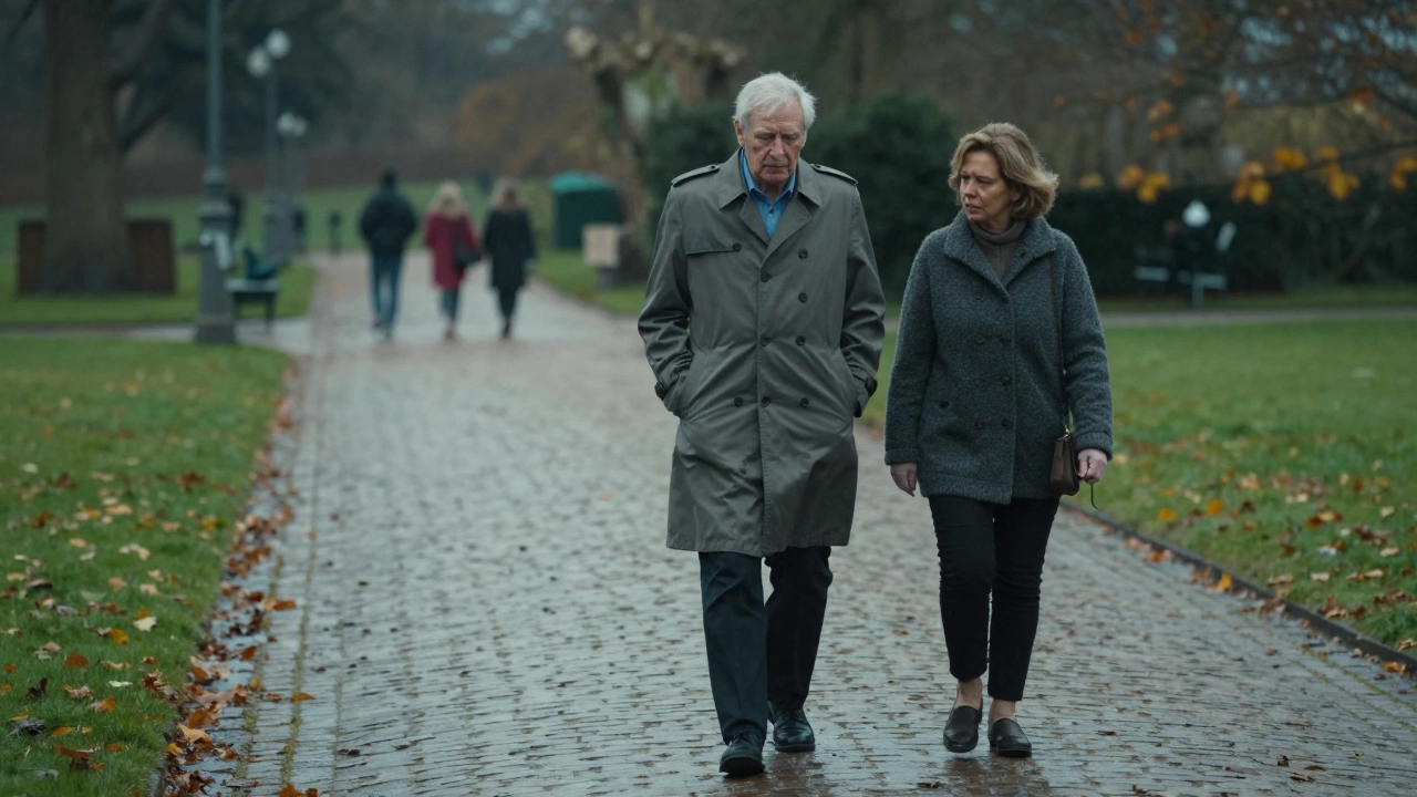 A man and woman walk silently through Luxembourg Gardens at dusk, rain-slicked paths and distant tourists framing their private moment of peace.